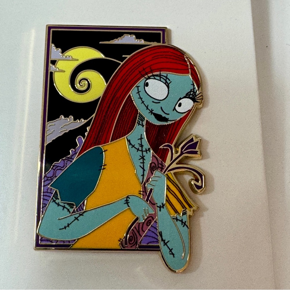 NWT. Disney Pin. Sally portrait Disney pin on original card back
